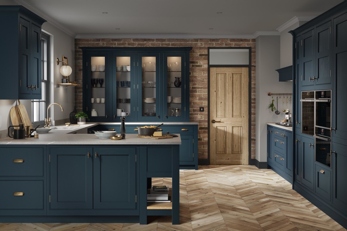 Bespoke kitchen with deep blue cabinetry and exposed brick